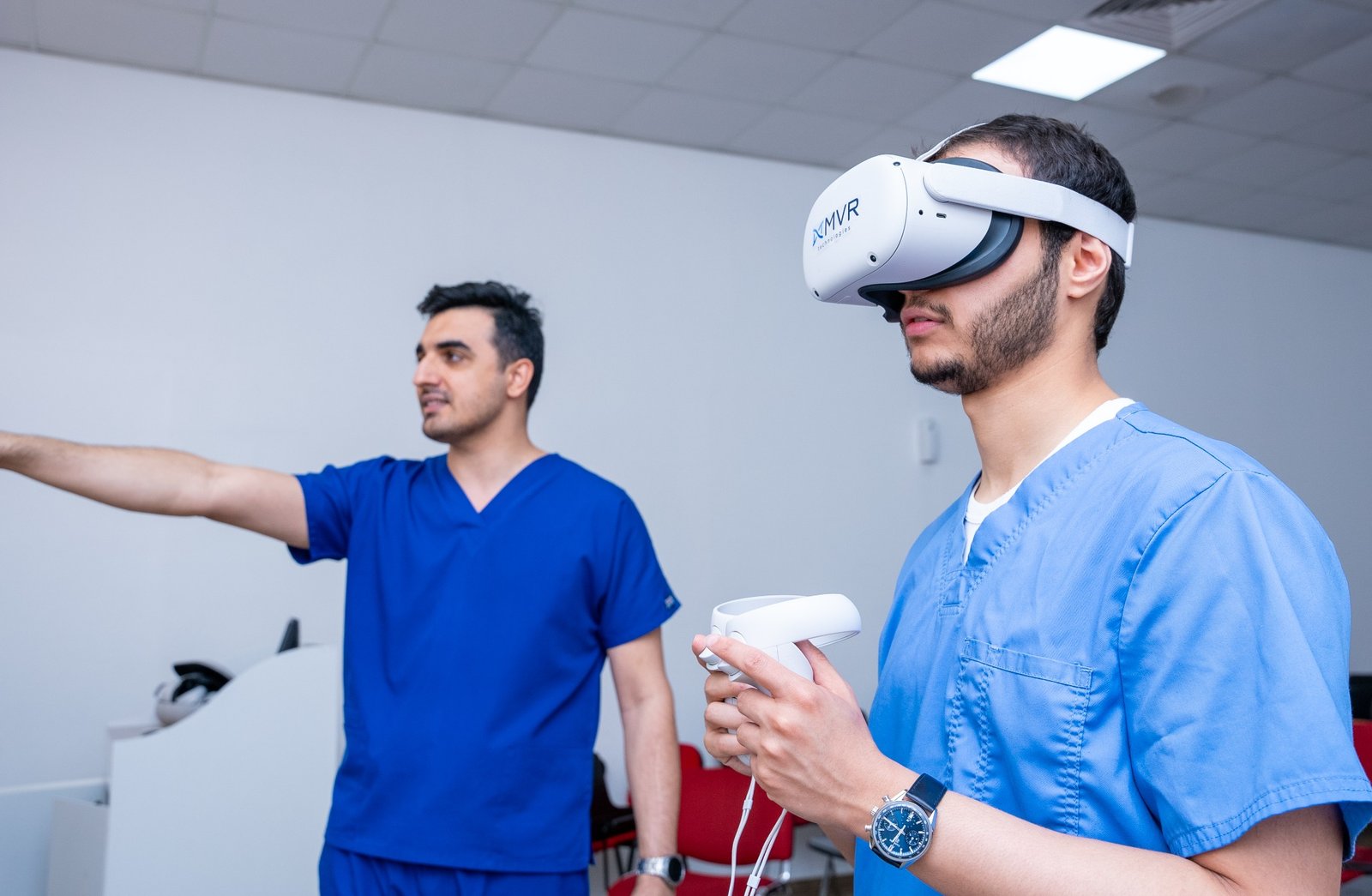 A learner using a VR headset and controller during a guided session